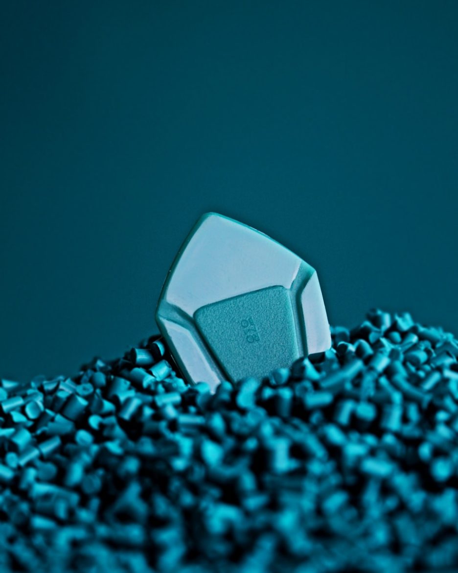 a computer mouse sitting on top of a pile of blue chips